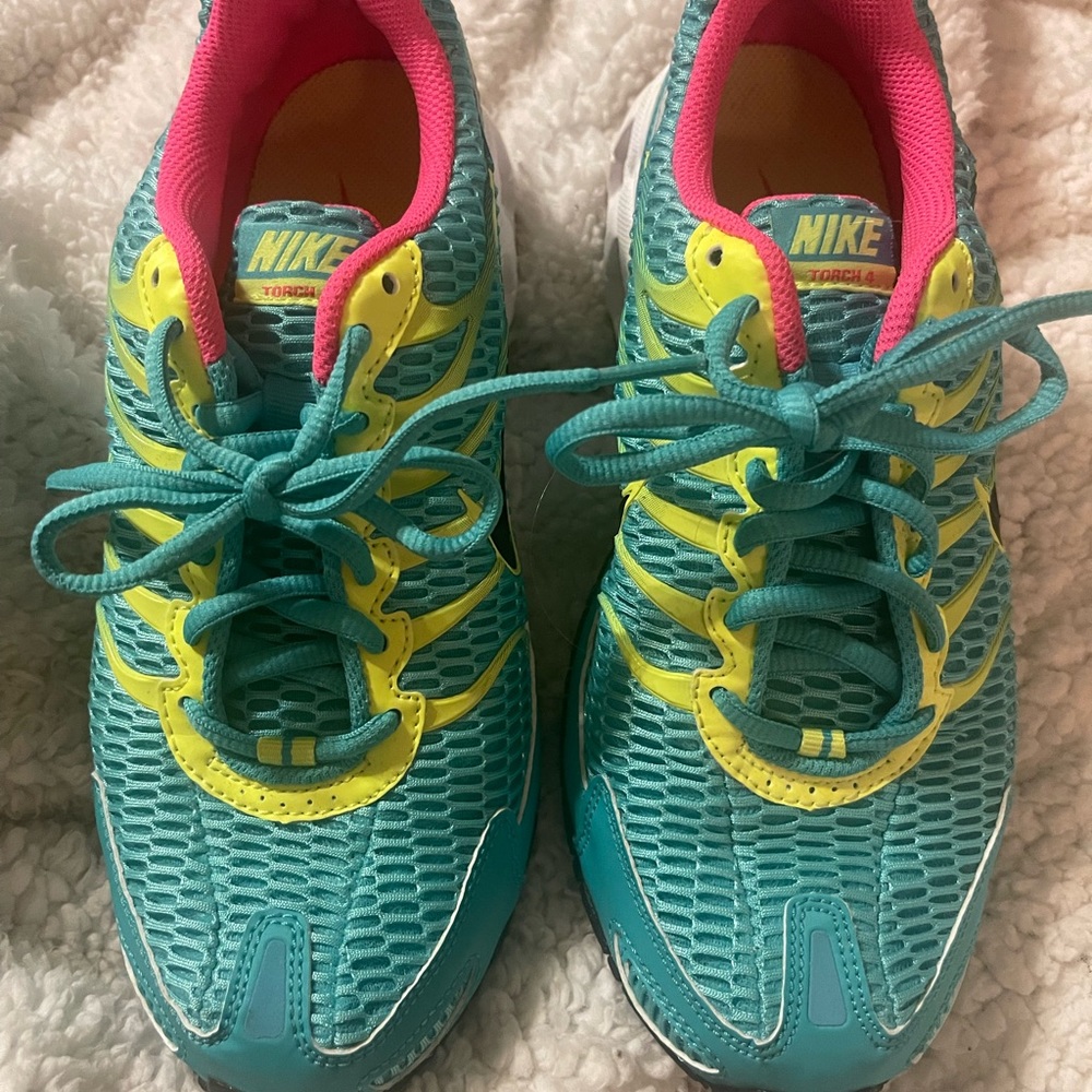 Aqua pink and yellow Nike air.